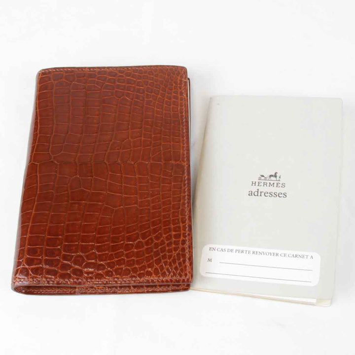 『USED』 
HERMES エルメス 
 アジェンダPM　□刻印不明瞭 手帳 
アリゲーター ブラウン