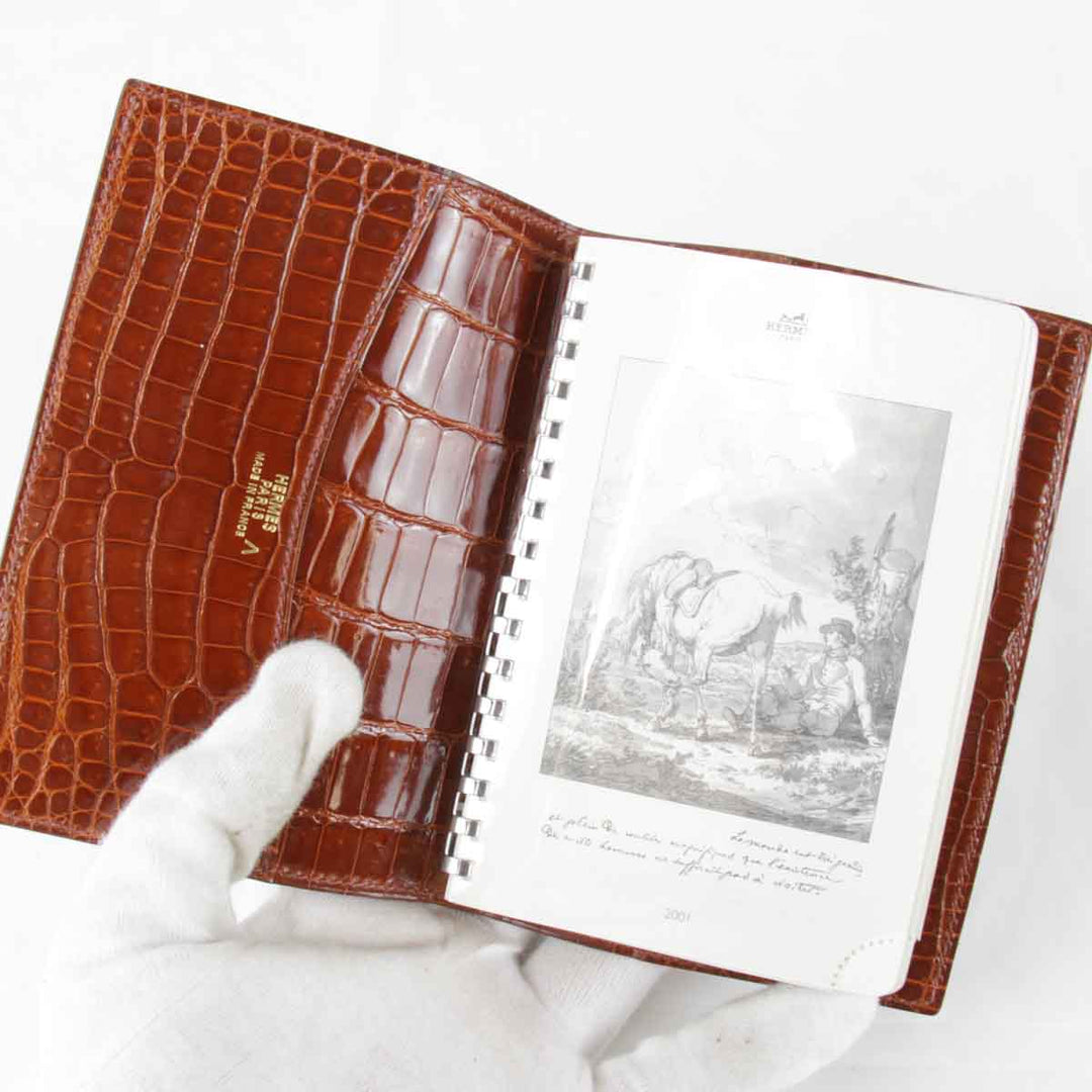 『USED』 
HERMES エルメス 
 アジェンダPM　□刻印不明瞭 手帳 
アリゲーター ブラウン