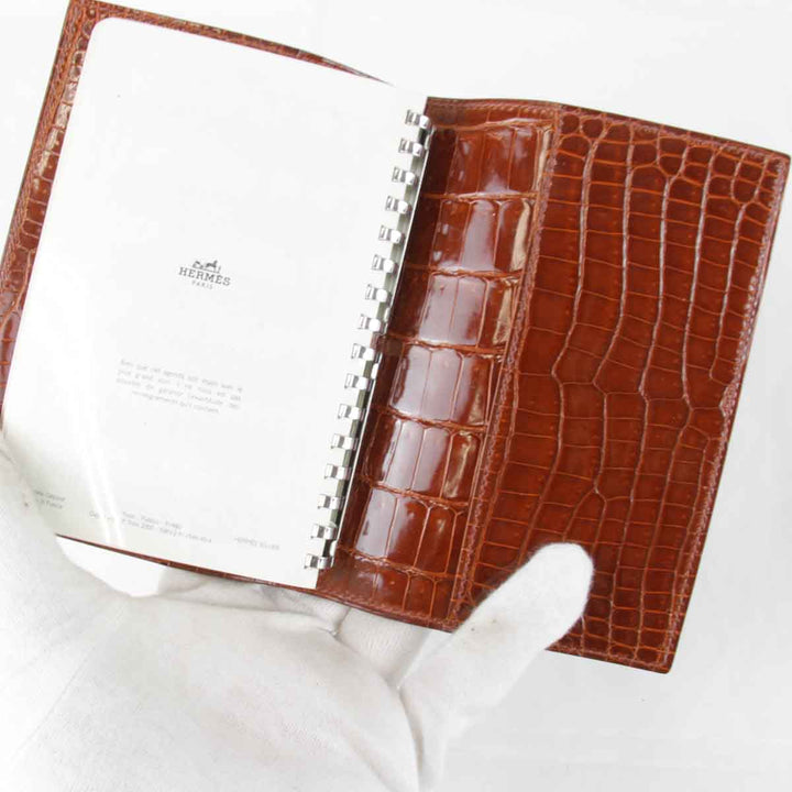 『USED』 
HERMES エルメス 
 アジェンダPM　□刻印不明瞭 手帳 
アリゲーター ブラウン