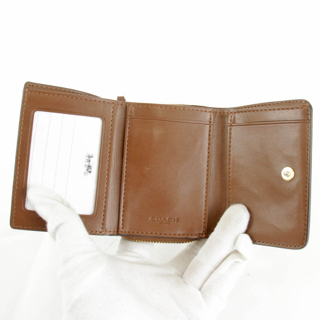 美品『USED』 
COACH コーチ 
 シグネチャー F41302 三つ折り財布 
PVCコーティングキャンバス ベージュ