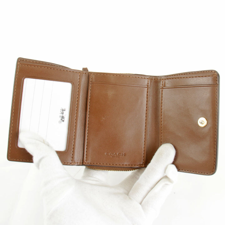 美品『USED』 
COACH コーチ 
 シグネチャー F41302 三つ折り財布 
PVCコーティングキャンバス ベージュ