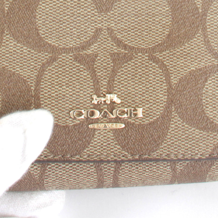 美品『USED』 
COACH コーチ 
 シグネチャー F41302 三つ折り財布 
PVCコーティングキャンバス ベージュ